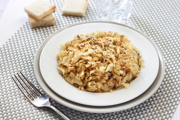 Fried cabbage with caraway and garlic on a plate