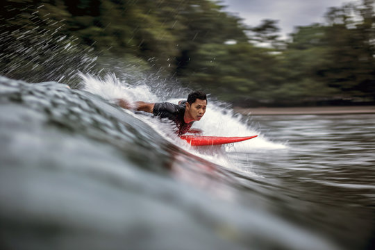 Man surfboarding in sea