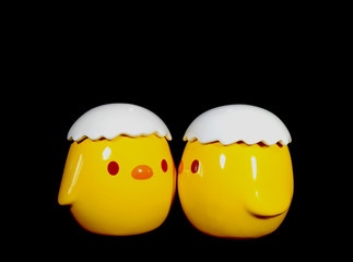 Two Vivid Yellow Kissing Baby Chicks Ceramic Doll on Black Background 