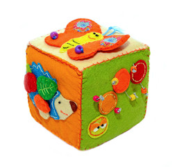 Fototapeta na wymiar Felt activity developing cube, baby soft sensory toy