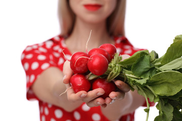 Woman holding fresh organic Vegetables radishes on white background. Dieting, Healthy Eating and lifestyle concept.