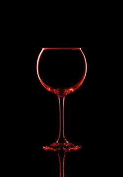 Elegant picture of wine glass over the black background