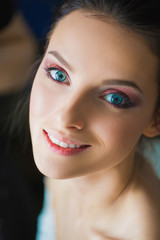 Beautiful woman with makeup indoor