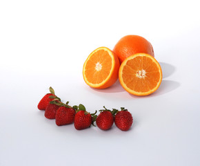 Strawberries and oranges in a smiley face