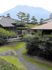 Ancient Residences at the Sengan En Gardens with Sakurajima Mountain background, Kagoshima, Japan