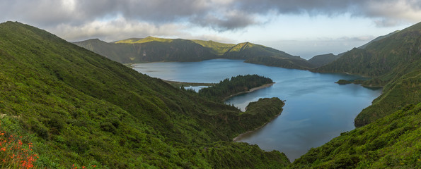 Wide panorama of scenic Lagoa do Fogo in late afternoon, Sao Miguel, Azores, Portugal