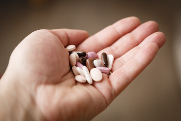 pills in woman hand, drug addiction