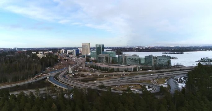 Route 51 Keilaniemi, Cinema 4k sideway aerial view on route 51 the l&auml;nsi-v&auml;yl&auml; and towards keilaniemi business center, on a sunny winter day, in espoo, Finland