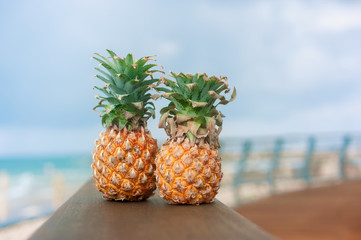 two pineapples on the sea beach. vacation or sport mood yoga fitness lifestyle 