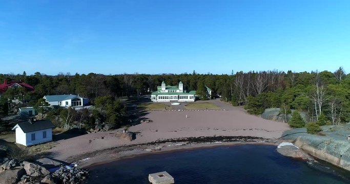Hanko Casino, Cinema 4k aerial sideway view of hanko casino, on a sunny spring day, in Hango, Finland