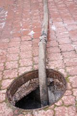 pumping sewage from the drain hole