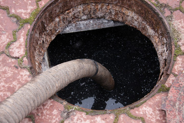 pumping sewage from the drain hole