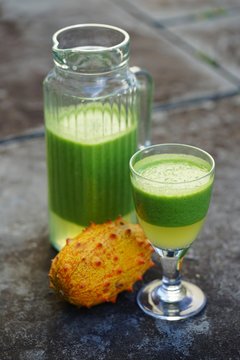 Green cocktail smoothie juice with kiwano horned melon