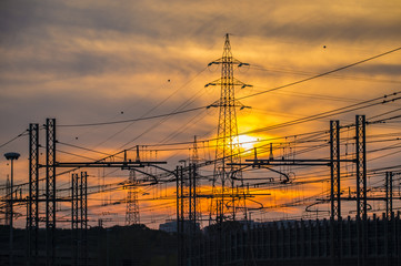 Silhouette of the electricity transmission pylon at sunset