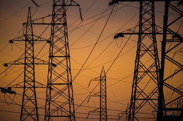Silhouette of the electricity transmission pylon at sunset