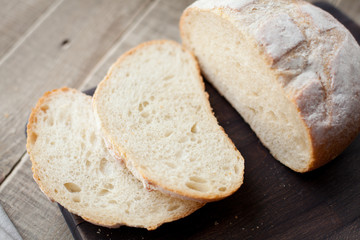 Sliced unleavened bread on a wooden table