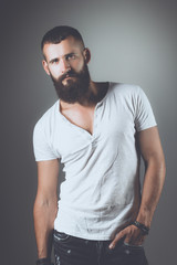 Obraz premium Portrait of handsome man standing, isolated on grey background