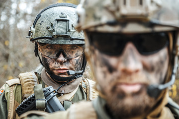 Norwegian Armed Forces Special Command FSK male and female soldiers closeup portrait. Radio and...