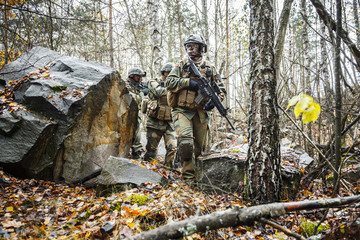 Norwegian Rapid reaction special forces FSK male and female soldiers in field uniforms patrolling...