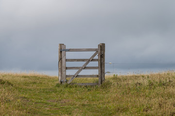The old gate without a fence near the field, The South West Coast Path near Hope Cove, Bolberry and...