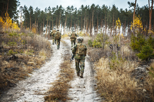 Norwegian Rapid reaction special forces FSK soldiers in field uniforms patrolling forest road