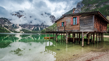 Fototapeta premium Stormy clouds over Pragser Wildsee in Dolomites, Europe