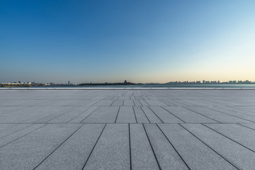 Empty brick floor with modern building in Shanghai