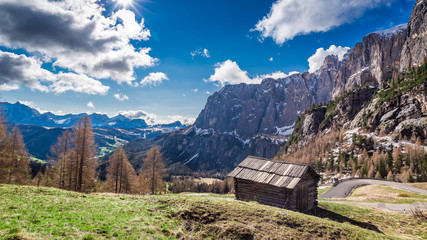 Fototapeta na wymiar Small old wooden house in the Dolomites, Italy, Europe