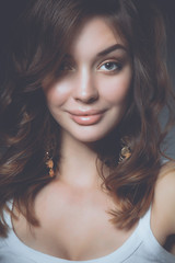 Close up portrait of beautiful young woman face. Isolated on white background.