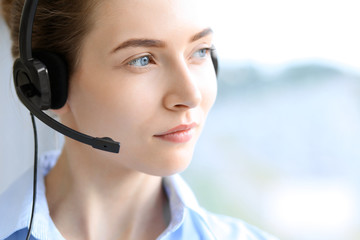 Call center operator. Portrait of beautiful business woman in headset.