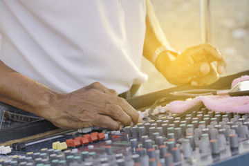 Sound engineer working with sound mixer.