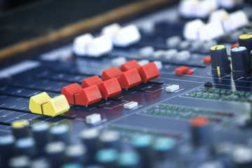 Audio mixing console in a recording studio.