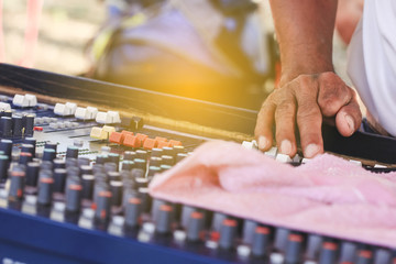 Sound engineer working with sound mixer.