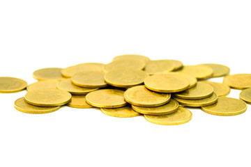 A pile of golden coins on white background. close up. selective focus.