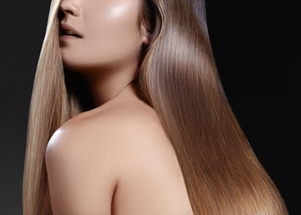 Fashion long hair. Beautiful brunette girl. Healthy straight shiny hair style. Smooth hairstyle. Keratin treatment, spa
