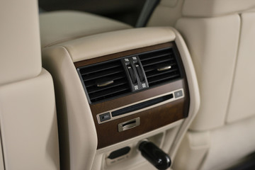 Four zone climate control. Car interior detail. Back passenger air vents. 