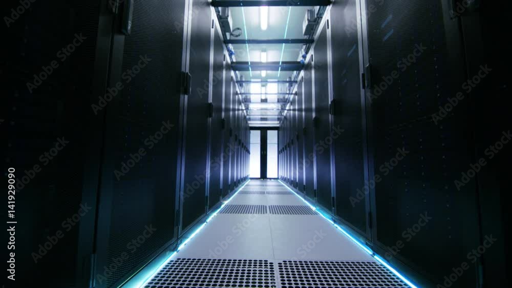 Poster camera moves through atmospherically illuminated data center with rows of rack servers and glass cei