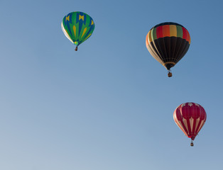 Colorful balloons flying through the blue sky. Utah, US