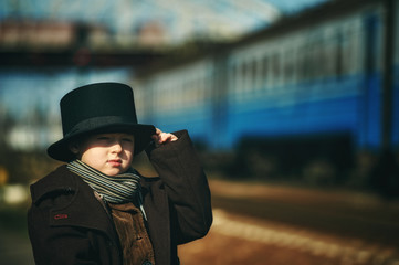 stylish retro portrait of a boy in the cylinder