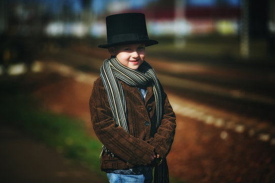 stylish retro portrait of a boy in the cylinder