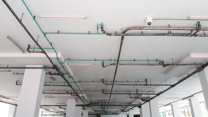 Sanitary system on bare skin ceiling.