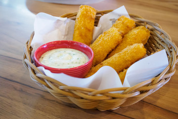 fresh fish fingers sticks with sauce