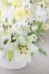 Floral arrangement with lilies, roses, eustoma, chrysanthemum and hortensia flower.