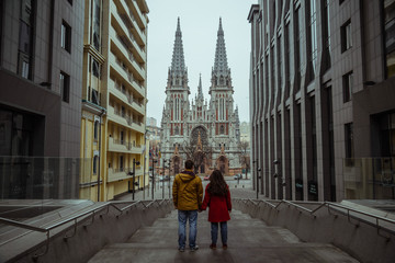 Fototapeta na wymiar couple look on gothic church