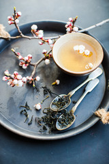 Green tea and peach blossom as a spring concept