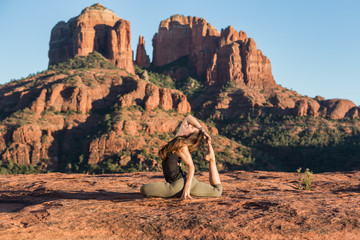 Woman Performing Yoga Exercises Outdoors