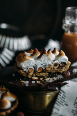 Chocolate Tartlets with nuts and Italian meringue