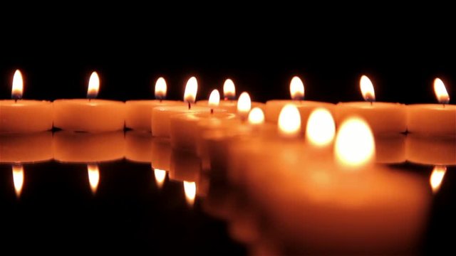 Candles on the mirror table. Follow focus shot