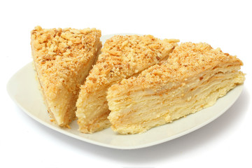 cake napoleon on plate isolated on white background