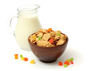 Glass jug pitcher of fresh milk with oatmeal and sweets isolated on white background carafe